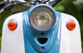 Front wing and headlight of blue retro scooter Royalty Free Stock Photo