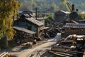 There are logs stacked up outside a woodworking plant in the neighborhood Royalty Free Stock Photo