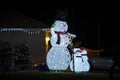 Front yard with brightly illuminated christmas decorations. Outside decor of florida family home for winter holidays Royalty Free Stock Photo