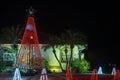 Front yard with brightly illuminated christmas decorations. Outside decor of florida family home for winter holidays Royalty Free Stock Photo