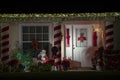 Front yard with brightly illuminated christmas decorations. Outside decor of florida family home for winter holidays Royalty Free Stock Photo