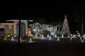 Front yard with brightly illuminated christmas decorations. Outside decor of florida family home for winter holidays Royalty Free Stock Photo