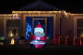 Front yard with brightly illuminated christmas decorations. Outside decor of florida family home for winter holidays Royalty Free Stock Photo