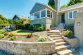 Front yard landscape with stone trim. House exterior