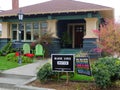 A front yard with Yard Signs supporting liberal views