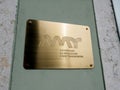 Front yellow gold signage plaque of Autoridade da mobilidade e dos transportes -