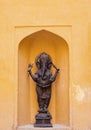 Front Zoom-in shot of a Ganesha statue made with precious metals and brass having black finishing in standing postition