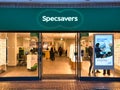 The frontage of a branch of optical retail chain Specsavers. The company sells glasses, sunglasses, contact lenses