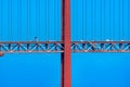 Frontal detail of part of the 25 de Abril suspension bridge with red steel cables supporting the structure with cars and vans Royalty Free Stock Photo