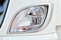 Frontal lighting products for on-highway vehicles, which includes integrated daytime running lights and beam patterns. Bi-Xenon