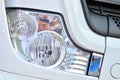 Frontal lighting products for on-highway vehicles, which includes integrated daytime running lights and beam patterns. Bi-Xenon