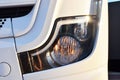 Frontal lighting products for on-highway vehicles, which includes integrated daytime running lights and beam patterns. Bi-Xenon