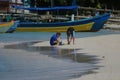 Beach morning on Roatan Bay Islands Honduras kids playing