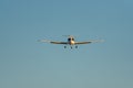 Frontal view of airplane approaching the runway at sunset Royalty Free Stock Photo