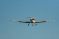 Frontal view of airplane approaching the runway at sunset Royalty Free Stock Photo