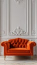 Frontal View of Classic Orange Couch in Front of White Wall Royalty Free Stock Photo