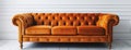 Classic Orange Leather Couch in a White Room Royalty Free Stock Photo