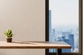 frontal view on empty clean wooden desk workplace minimalist office background with panoramic view on big city skyline digital Royalty Free Stock Photo