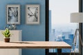 frontal view on empty clean wooden desk workplace minimalist office background with panoramic view on big city skyline digital Royalty Free Stock Photo