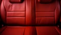 Frontal view of modern luxury car with premium red leather back seats exquisite craftsmanship Royalty Free Stock Photo