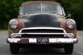 Frontal view of an old rusty Chevrolet Deluxe with Atlanta plate Royalty Free Stock Photo