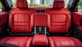 Frontal view of a sleek modern luxury car showcasing exquisite red leather back passenger seats Royalty Free Stock Photo