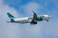 Frontier Airbus A320 flying in the cloudy sky Royalty Free Stock Photo