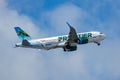 Frontier Airbus A320 flying in the cloudy sky