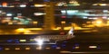 Frontier Airlines Airbus A319-111 N908FR landing at night at San Diego International Airport.