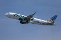 Frontier Airlines flying up in the sky