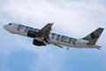 Frontier Airlines flying up in the sky