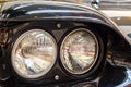 Frontlights of old Exclusive Luxury Rolls-Royce vintage car ckose-up. Royalty Free Stock Photo