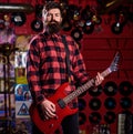 Frontman concept. Musician with beard play electric guitar