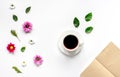 Froral flat lay with cup and notepaper top view mockup Royalty Free Stock Photo