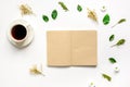 Froral flat lay with cup and notepaper top view mockup Royalty Free Stock Photo