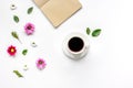 Froral flat lay with cup and notepaper top view mockup Royalty Free Stock Photo