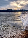 Frost crystal border between floe and dark water on lake. Natural view Royalty Free Stock Photo