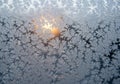 Frost forms intricate patterns on a window, with delicate, feathery Royalty Free Stock Photo