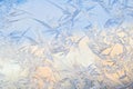 Frost on glass window. Abstract macro wallpaper bright background. Blue and pink crystal ice texture in sunlight Royalty Free Stock Photo