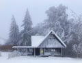 Frost hut at winter in mist forest Royalty Free Stock Photo
