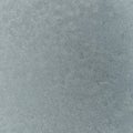 Frost on the metal surface of the car with a gray blur effect. Abstract background and texture for design. Royalty Free Stock Photo