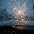 Frost patterns cover a car windshield, creating intricate ice formations. Royalty Free Stock Photo