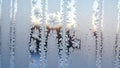 Frost patterns on a window create intricate feathery designs Royalty Free Stock Photo