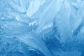 Frost patterns on window glass in winter. Frosted Glass Texture. Blue Royalty Free Stock Photo