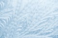 Frost patterns on window glass in winter season. Frosted Glass Texture. Blue background Royalty Free Stock Photo