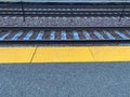 Frost settles on railroad tracks along station platform Royalty Free Stock Photo