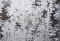 Frost on the window, natural pattern. Frozen particles on a window glass. Different ice crystals texture background Royalty Free Stock Photo