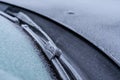 Frostbitten windshield wiper on the morning of winter covered with ice and frost Royalty Free Stock Photo