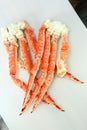 frosted Alaska king crab legs closeup photo on white table background Royalty Free Stock Photo