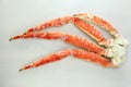 frosted Alaska king crab legs closeup photo on white table background Royalty Free Stock Photo